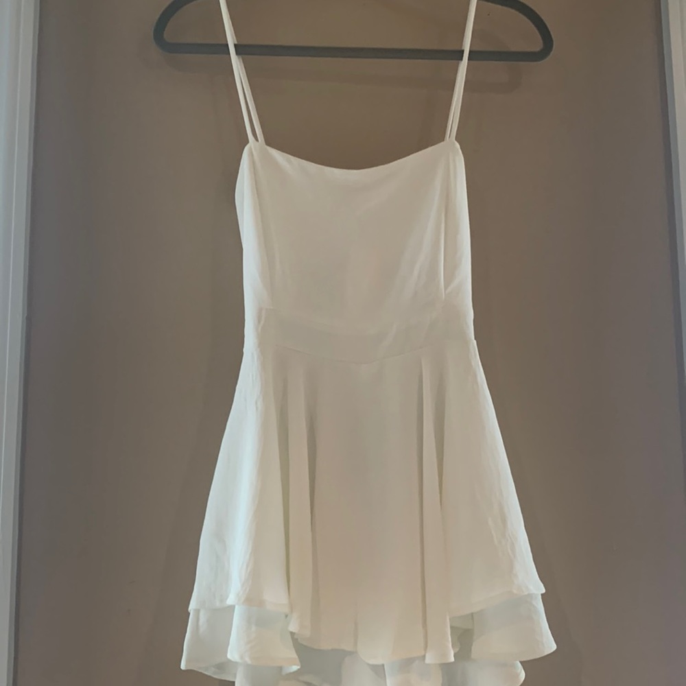 Akira White romper with cutout and tie in back (fits xs-m)